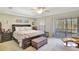 King-size bedroom with ample closet space and access to a balcony at 5025 St Andrews Arc, Leesburg, FL 34748