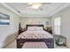 Main bedroom with king bed and access to the balcony at 5025 St Andrews Arc, Leesburg, FL 34748