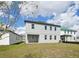 View of the backyard with a lawn and the rear of the house at 5714 Cattle Ranch Dr, St Cloud, FL 34771