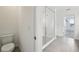 Bathroom featuring a shower, toilet, and tile flooring at 5714 Cattle Ranch Dr, St Cloud, FL 34771