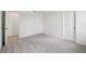 Bedroom featuring neutral carpet and an open doorway at 5714 Cattle Ranch Dr, St Cloud, FL 34771