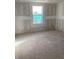 Unfinished bedroom with a window at 5714 Cattle Ranch Dr, Saint Cloud, FL 34771