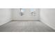 Bedroom with neutral carpet and two bright windows that provide natural light at 5714 Cattle Ranch Dr, St Cloud, FL 34771