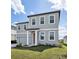 Charming two-story home featuring a two-car garage and lush green lawn at 5714 Cattle Ranch Dr, St Cloud, FL 34771