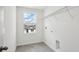 Bright laundry room featuring a window with a view at 5714 Cattle Ranch Dr, St Cloud, FL 34771