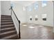 Bright living area showcases soaring ceilings, lots of natural light, and wood-look tile floors at 5714 Cattle Ranch Dr, St Cloud, FL 34771