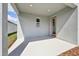 Covered patio with concrete floor, a wood door, and room for seating at 5714 Cattle Ranch Dr, St Cloud, FL 34771