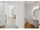 Modern powder room with pedestal sink and neutral finishes at 5714 Cattle Ranch Dr, St Cloud, FL 34771