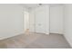 Bedroom with carpeted floor and a closet with double doors and a bathroom entrance at 5715 Cattle Ranch Dr, St Cloud, FL 34771