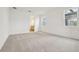 Large bedroom with three large, bright windows and an attached bathroom at 5715 Cattle Ranch Dr, St Cloud, FL 34771