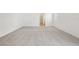 Bright bedroom features soft carpet, white walls, and natural light at 5715 Cattle Ranch Dr, St Cloud, FL 34771