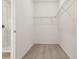 Bright and organized walk-in closet with wire shelving at 5715 Cattle Ranch Dr, St Cloud, FL 34771