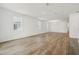 Spacious, bright living room featuring gorgeous wood flooring and natural light at 5715 Cattle Ranch Dr, St Cloud, FL 34771