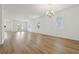 Large living room with abundant natural light, wood-look floors and sliding glass doors to the yard at 5715 Cattle Ranch Dr, St Cloud, FL 34771