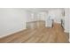 Bright, open-concept living area with kitchen island and hardwood floors at 5715 Cattle Ranch Dr, St Cloud, FL 34771