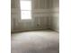 Unfurnished bedroom with drywall and a window at 5723 Cattle Ranch Dr, Saint Cloud, FL 34771