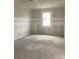 Unfurnished bedroom with drywall and a window at 5723 Cattle Ranch Dr, Saint Cloud, FL 34771