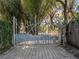 Unique custom gate design adding an artistic touch to the property's entrance at 6320 Rocky Point Rd, Lake Wales, FL 33898