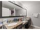Bathroom boasts granite countertops and double sinks at 8167 Roseville Rd, Davenport, FL 33896