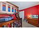 Bedroom with bunk beds and red walls at 8167 Roseville Rd, Davenport, FL 33896