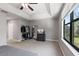 Spacious bedroom with large window and ceiling fan at 8167 Roseville Rd, Davenport, FL 33896