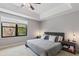 Main bedroom with large window, ceiling fan and plenty of space at 8167 Roseville Rd, Davenport, FL 33896