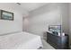 Bright bedroom with double bed and dresser at 8167 Roseville Rd, Davenport, FL 33896
