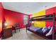 bedroom with bunk beds and red and yellow walls at 8167 Roseville Rd, Davenport, FL 33896