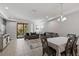 Dining area with table and chairs, open to living area at 8167 Roseville Rd, Davenport, FL 33896