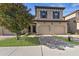 Two-story townhome with two-car garage and landscaped front yard at 8167 Roseville Rd, Davenport, FL 33896