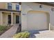 Two-car garage with paved driveway at 8167 Roseville Rd, Davenport, FL 33896