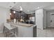 Kitchen with granite countertops and dark cabinets at 8167 Roseville Rd, Davenport, FL 33896