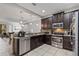 Modern kitchen with stainless steel appliances and granite countertops at 8167 Roseville Rd, Davenport, FL 33896