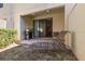 Private patio with lounge chair and gas grill at 8167 Roseville Rd, Davenport, FL 33896