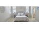 Bright bedroom with stylish decor, including a cozy bed, decorative pillows, and matching side tables at 12859 Enclave Dr, Orlando, FL 32837