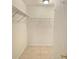 Spacious walk-in closet with ample shelving for storage, and neutral colors at 12859 Enclave Dr, Orlando, FL 32837