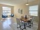 Open dining area connected to a sitting room, offering a spacious and flexible living space at 12859 Enclave Dr, Orlando, FL 32837