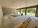Unfinished basement with concrete walls, and three large openings offering abundant natural light and ventilation at 1309 Errol Green Ct, Apopka, FL 32712