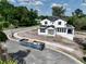 An aerial view shows a new white home under construction on a large lot near other homes at 1309 Errol Green Ct, Apopka, FL 32712