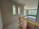 Bright living room featuring large windows and fresh drywall, ready for personalization at 1309 Errol Green Ct, Apopka, FL 32712