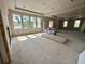Bright, unfinished living room with large windows and custom ceiling detail, ready for personalization at 1309 Errol Green Ct, Apopka, FL 32712