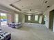 Spacious living room under construction, featuring large windows, custom ceiling detail, and ample natural light at 1309 Errol Green Ct, Apopka, FL 32712