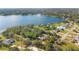 Aerial view of lakeside home with expansive lot and lake access at 7200 Grace Rd, Orlando, FL 32819