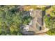 A bird's-eye view showing roof and surrounding trees and driveway at 7200 Grace Rd, Orlando, FL 32819