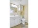 Updated bathroom featuring a white vanity, mirror, and a toilet with shelving at 7200 Grace Rd, Orlando, FL 32819