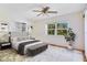 Airy bedroom with large window, neutral decor, ceiling fan, and built-in storage at 7200 Grace Rd, Orlando, FL 32819