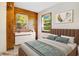 Cozy bedroom with wood-paneled wall, natural light and stylish decor for a relaxing ambiance at 7200 Grace Rd, Orlando, FL 32819