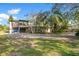 Charming two-story home with lush landscaping and mature trees at 7200 Grace Rd, Orlando, FL 32819