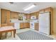 Updated kitchen featuring light wood cabinets and modern appliances at 7200 Grace Rd, Orlando, FL 32819