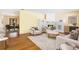 Inviting living room featuring fireplace, wood flooring, and stylish furniture; perfect for relaxing or entertaining at 7200 Grace Rd, Orlando, FL 32819